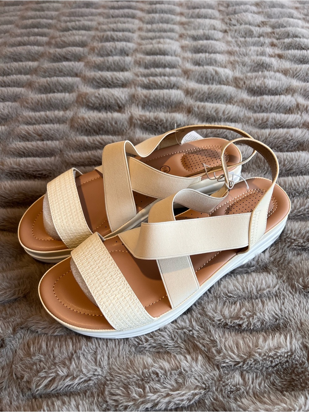 Cream sandals with flexible straps